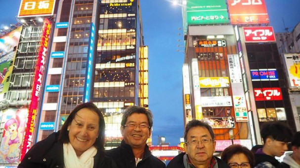 Night tour with portrait photography, walking around the largest downtown area in Japan with a local guide